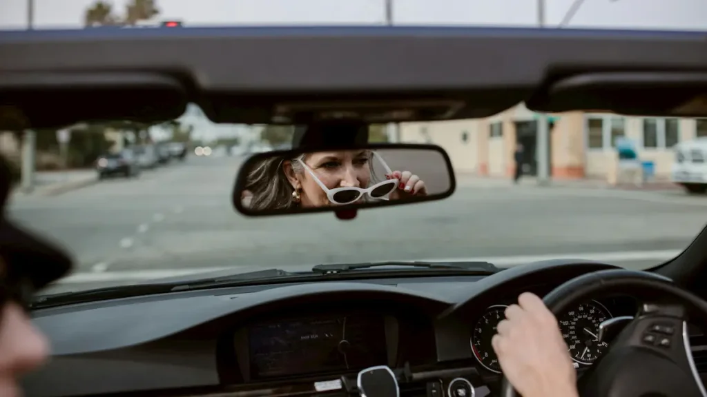 Woman driving a car that has comprehensive car insurance